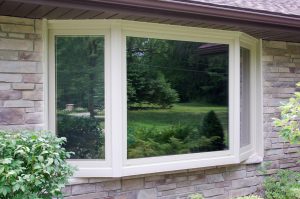 A bay window on a brick home