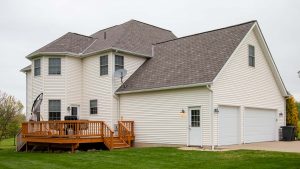 Newly built house with multiple windows and Asphalt roofing