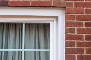 Close up view of white color window with siding